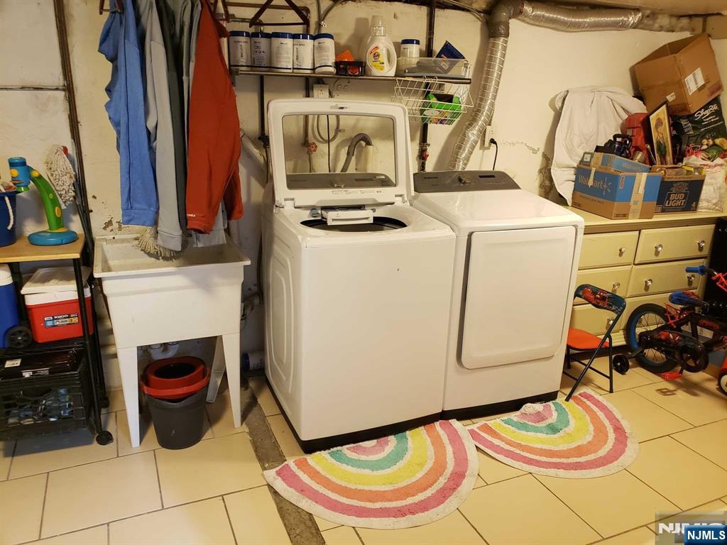 39 Tuttle Street Wallington, NJ 07057 - Photo 24 of 30 a utility room with dryer and washer