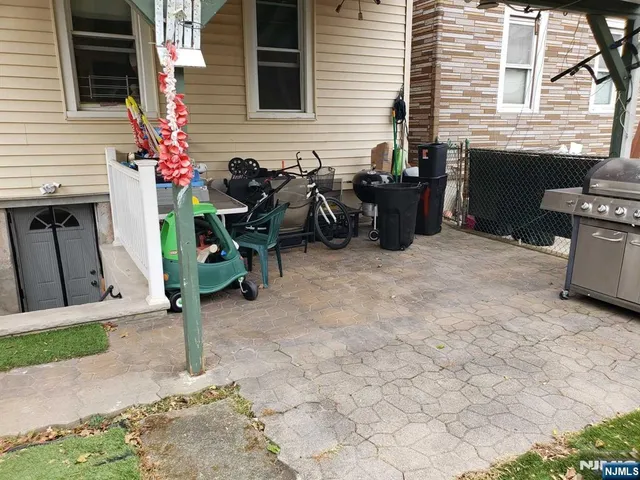 a view of house with yard and outdoor seating
