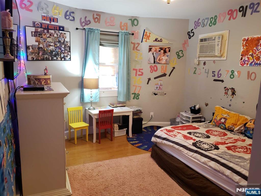 39 Tuttle Street Wallington, NJ 07057 - Photo 4 of 30 a bedroom with a bed and furniture