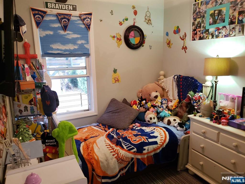 39 Tuttle Street Wallington, NJ 07057 - Photo 6 of 30 a room with furniture and a window