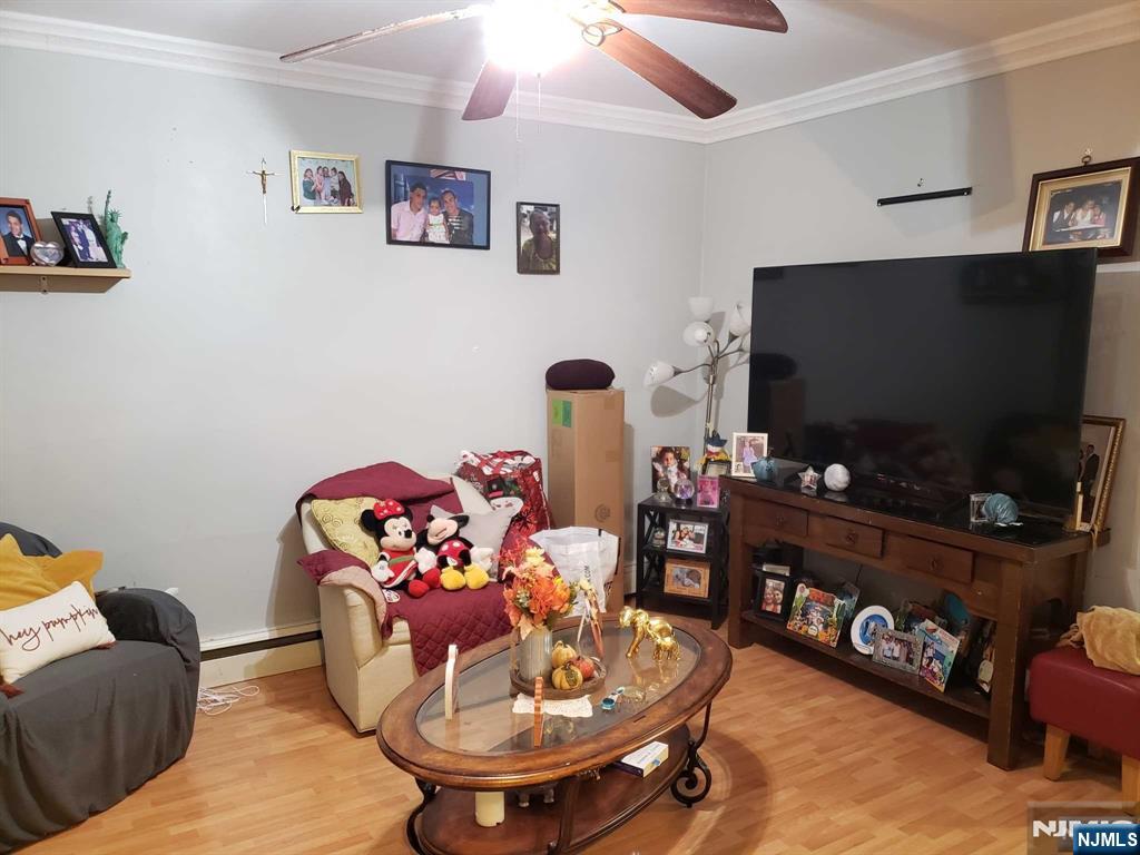 39 Tuttle Street Wallington, NJ 07057 - Photo 10 of 30 a living room with furniture and a flat screen tv