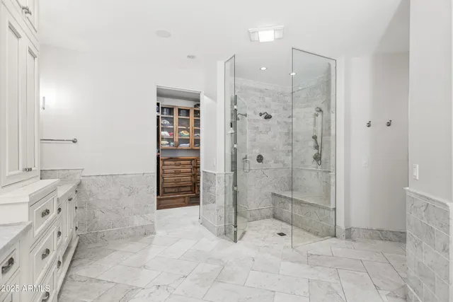 a bathroom with a shower and a sink