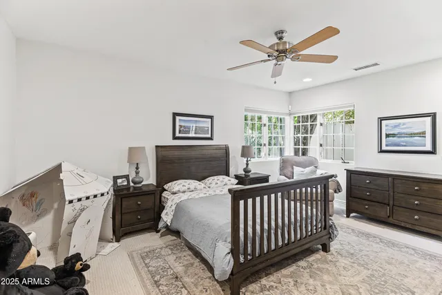 a bed room with a bed and a window