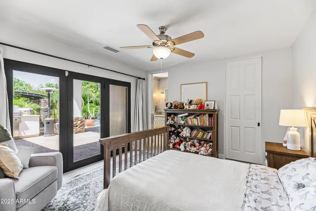a bathroom with a granite countertop shower sink and mirror
