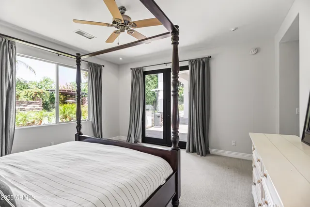 a bedroom with a bed dresser and a window