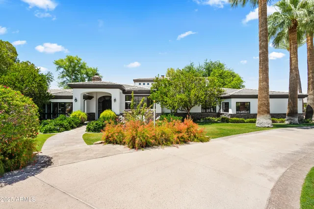 a house with garden in front of it