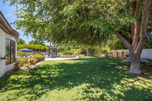 a view of yard with swimming pool and sitting area