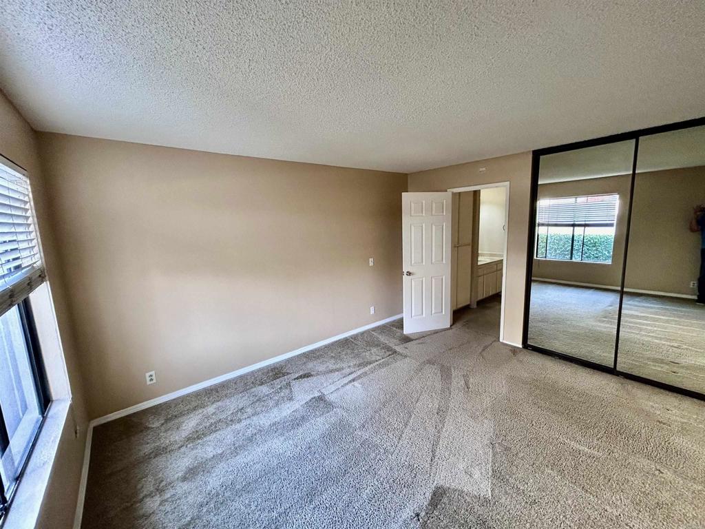 2425 Cranston Drive, Unit 204 Escondido, CA 92025 - Photo 11 of 17 an empty room with sliding door