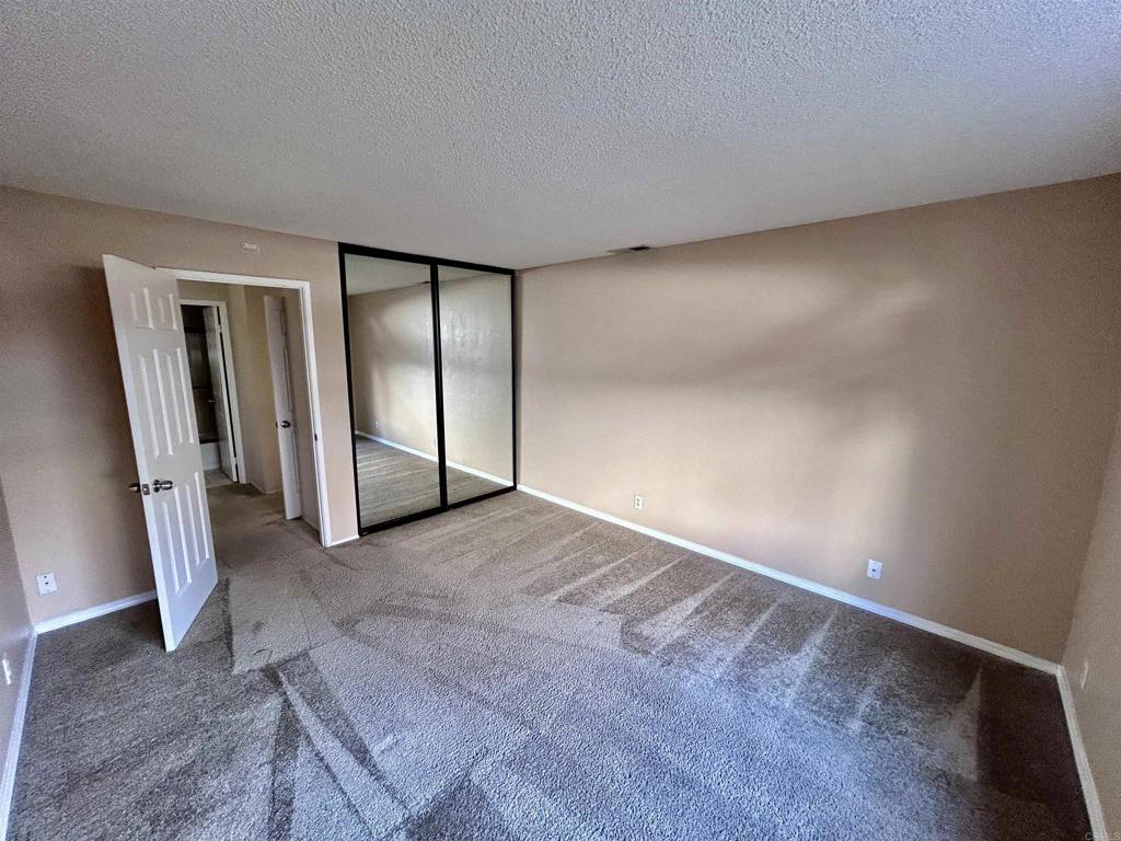 2425 Cranston Drive, Unit 204 Escondido, CA 92025 - Photo 12 of 17 an empty room with windows
