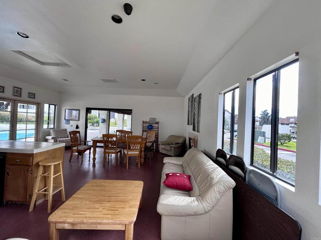 2425 Cranston Drive, Unit 204 Escondido, CA 92025 - Photo 16 of 17 a living room with furniture and a large window
