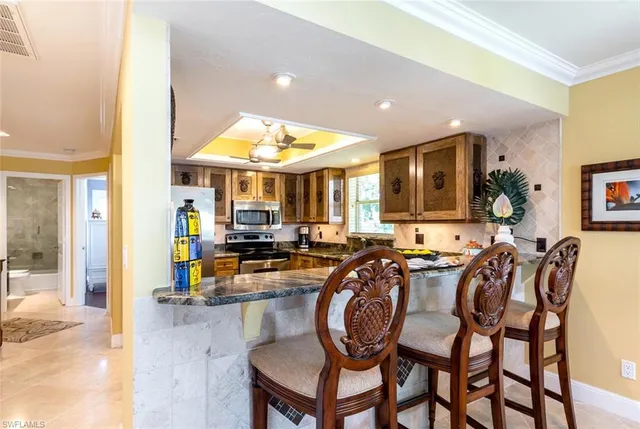 a kitchen with a table and chairs