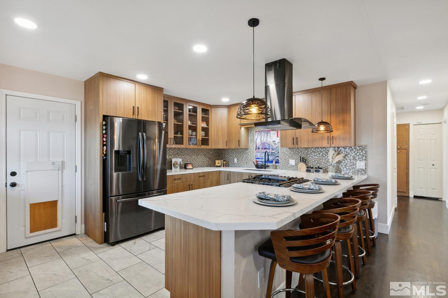3175 Bryan Street Reno, NV 89503 - Photo 1 of 18 a kitchen with stainless steel appliances a dining table and chairs
