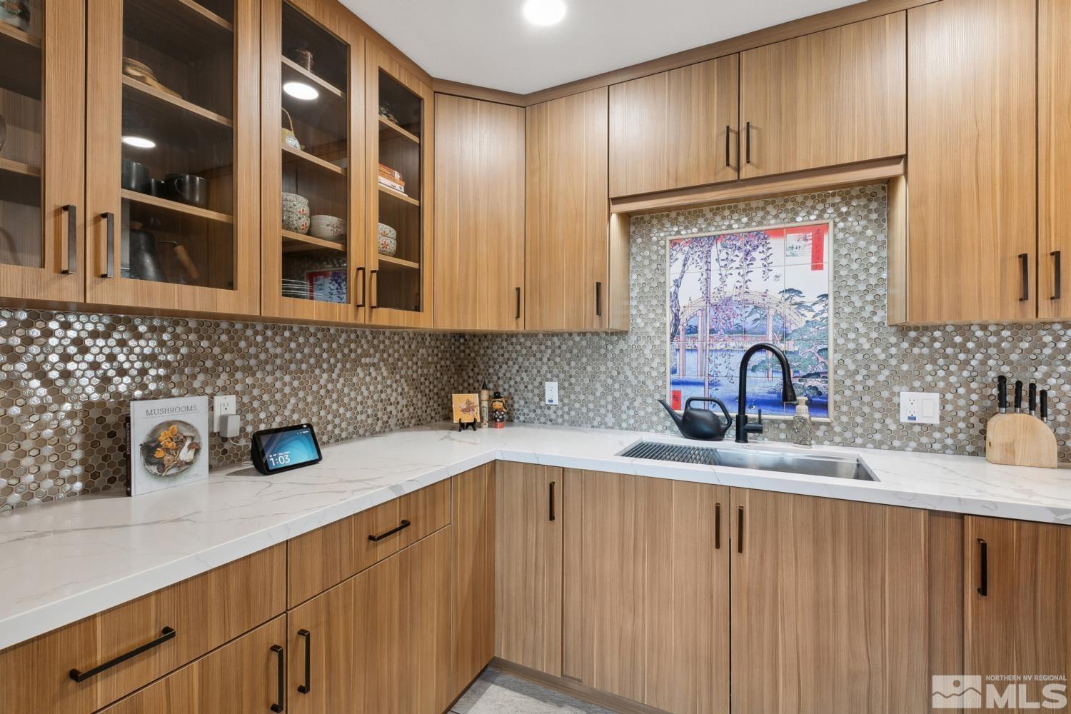 3175 Bryan Street Reno, NV 89503 - Photo 5 of 18 a kitchen with stainless steel appliances granite countertop a sink a stove and cabinets