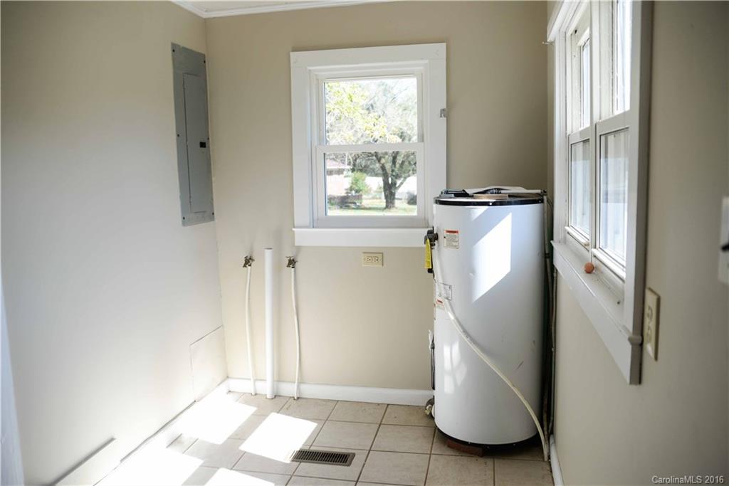 139 Duncan Road Olin, NC 28660 - Photo 17 of 24 a view of a storage & utility room with refrigerator and window