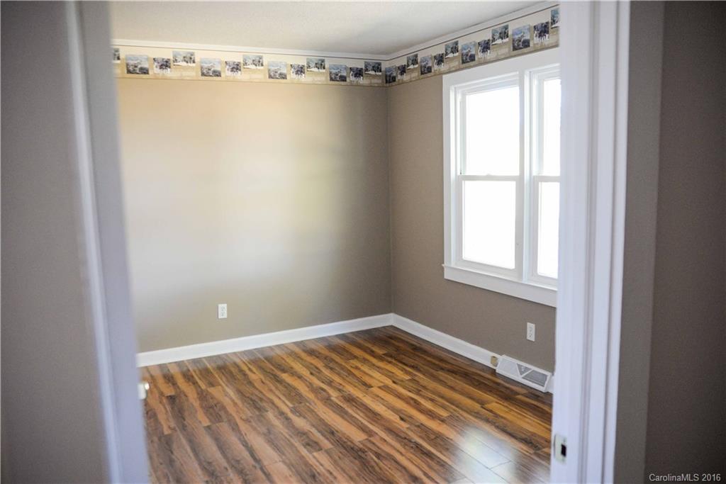 139 Duncan Road Olin, NC 28660 - Photo 21 of 24 a view of a room with wooden floor and windows