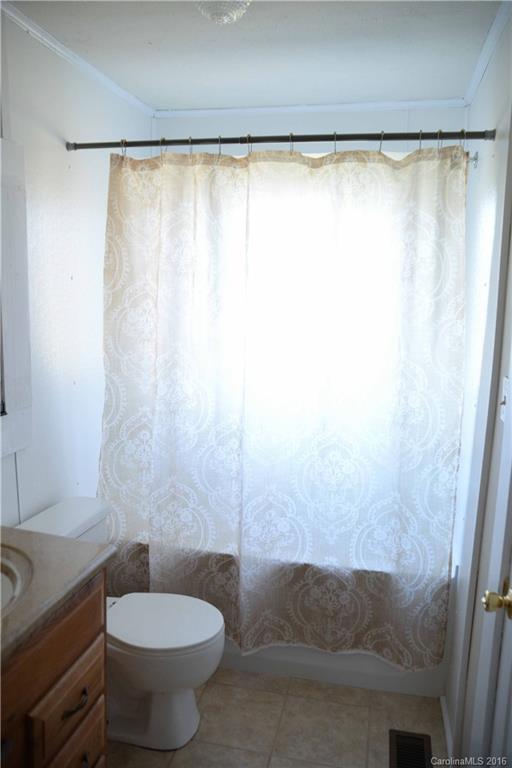 139 Duncan Road Olin, NC 28660 - Photo 24 of 24 a bathroom with a sink and a toilet