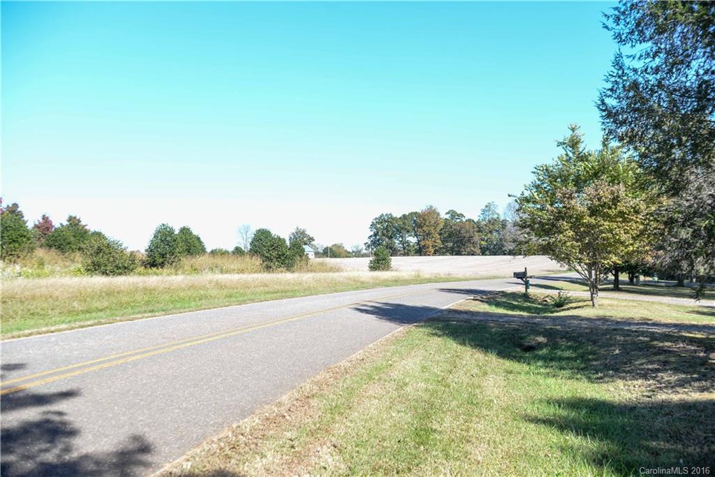 139 Duncan Road Olin, NC 28660 - Photo 5 of 24 a view of a lake and yard