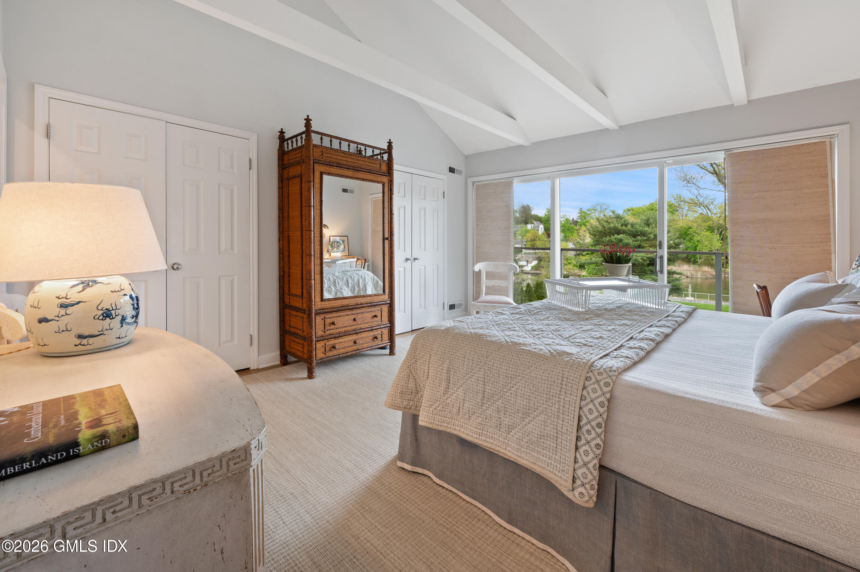115 River Road, Unit 3 Cos Cob, CT 06807 - Photo 30 of 40 a bedroom with a large bed and a window