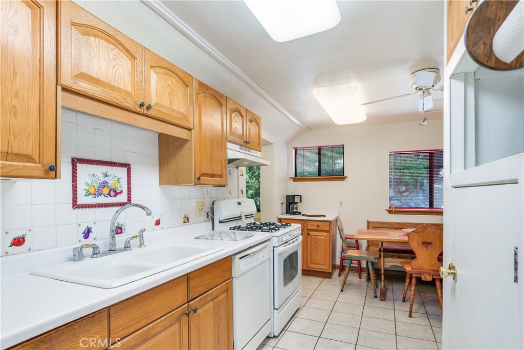 9339 Wood Road Forest Falls, CA 92339 - Photo 22 of 48 a kitchen with a sink and a stove top oven