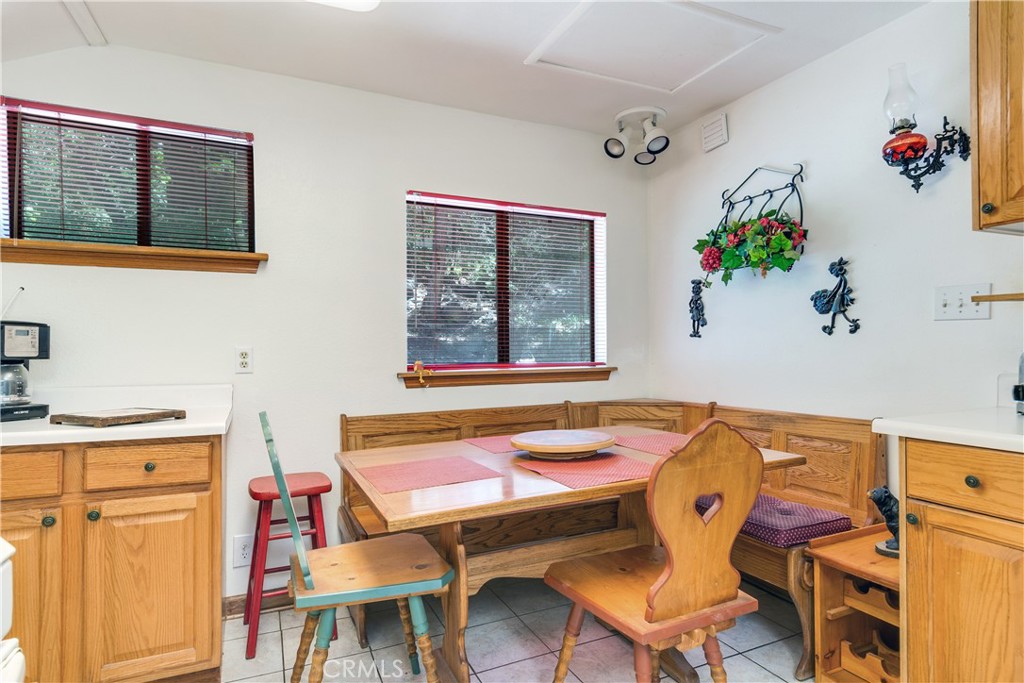 9339 Wood Road Forest Falls, CA 92339 - Photo 23 of 48 a dining room with furniture and window