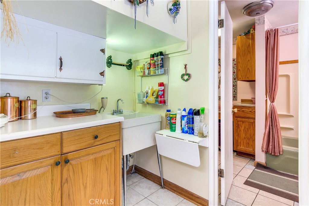9339 Wood Road Forest Falls, CA 92339 - Photo 25 of 48 a kitchen with a white cabinets and appliances