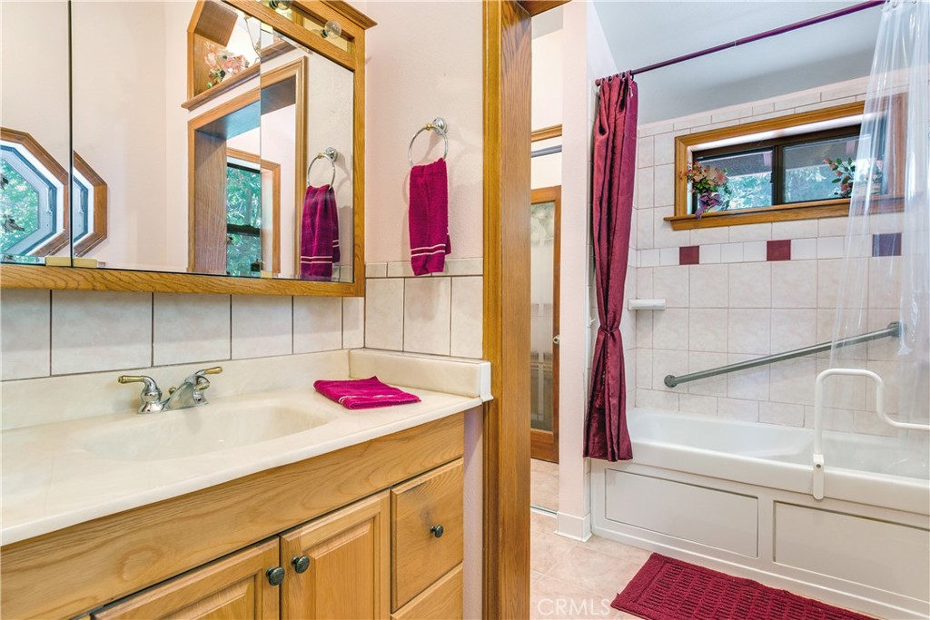 9339 Wood Road Forest Falls, CA 92339 - Photo 37 of 48 a bathroom with a sink and a mirror