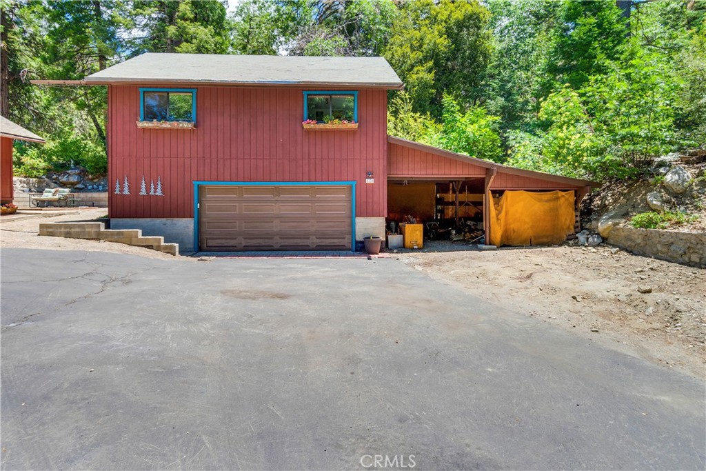 9339 Wood Road Forest Falls, CA 92339 - Photo 42 of 48 a view of a house with a yard and garage