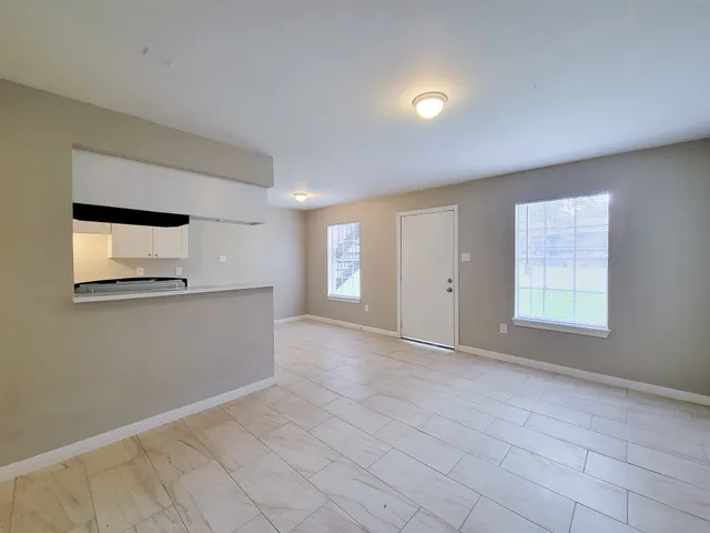 a view of an empty room with a window