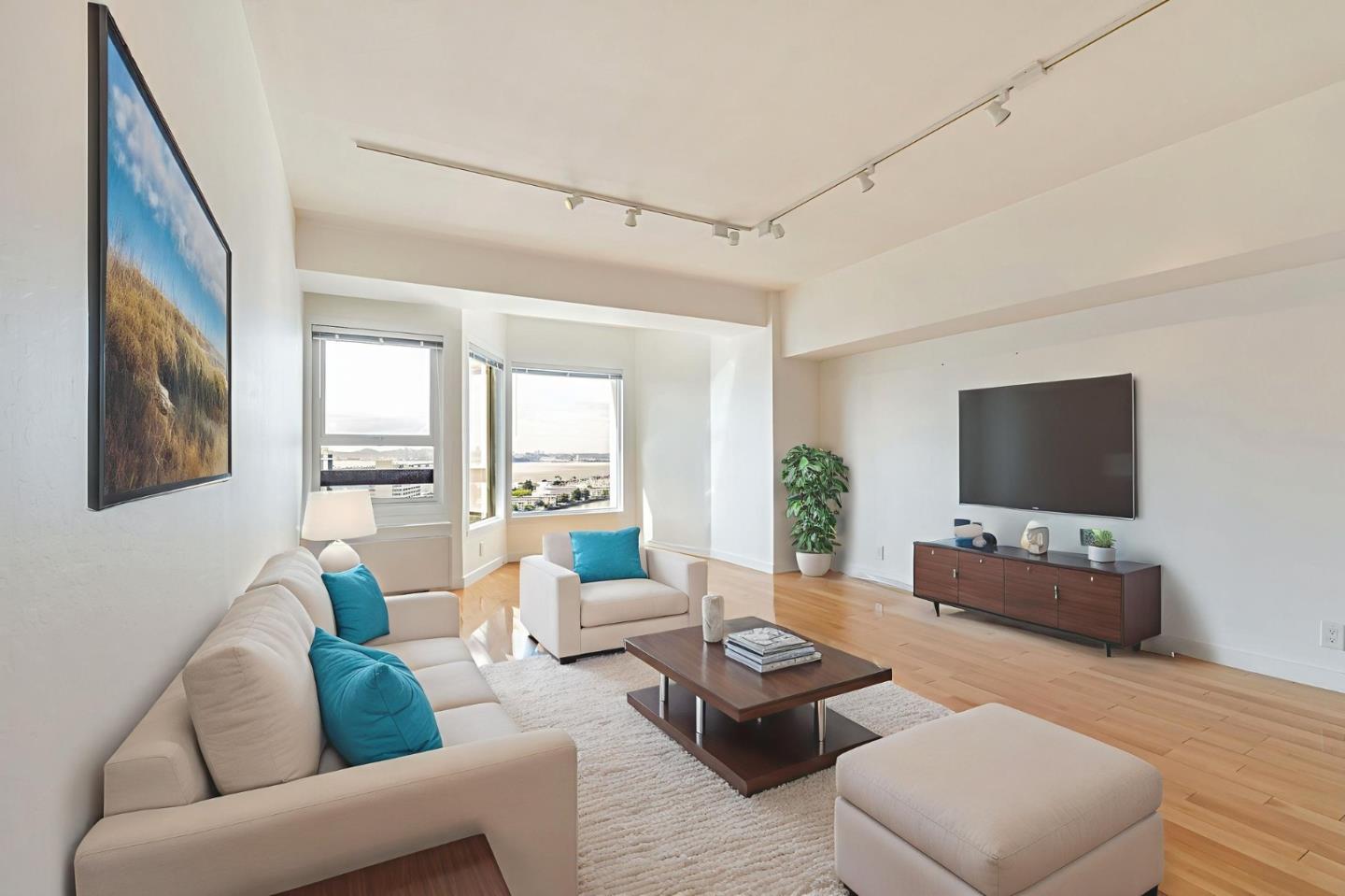 a living room with furniture and a flat screen tv
