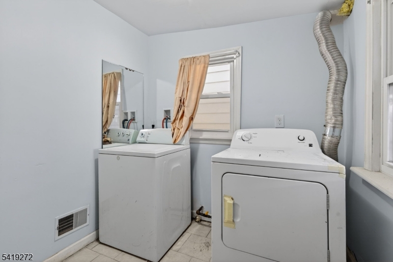 136 Smith Street Elizabeth, NJ 07201 - Photo 13 of 45 a utility room with dryer and washer