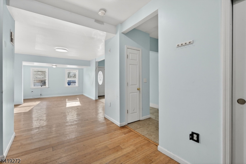 136 Smith Street Elizabeth, NJ 07201 - Photo 15 of 45 an empty room with wooden floor and windows