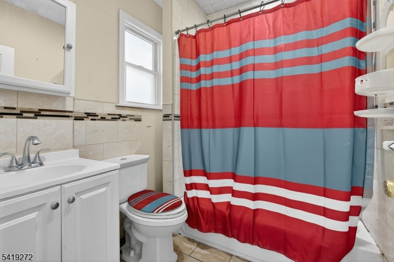 136 Smith Street Elizabeth, NJ 07201 - Photo 16 of 45 a bathroom with a sink toilet and shower