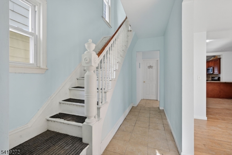 136 Smith Street Elizabeth, NJ 07201 - Photo 17 of 45 a view of a hallway with wooden floor and entryway