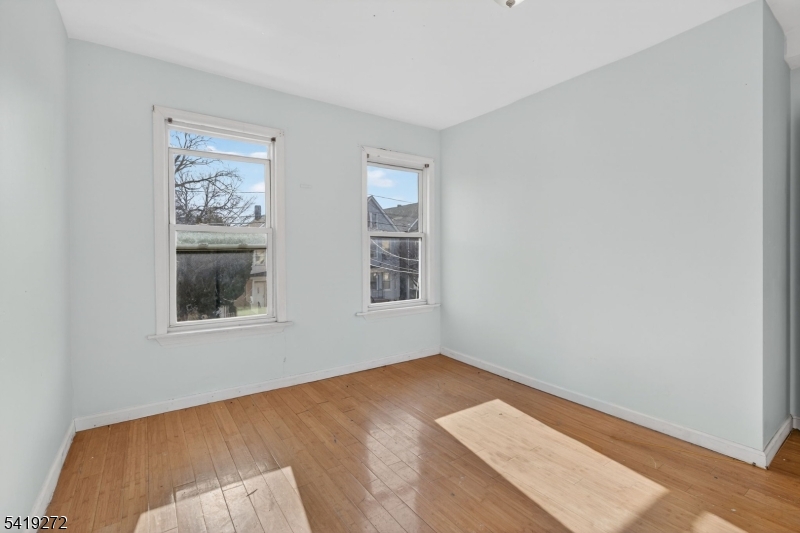 136 Smith Street Elizabeth, NJ 07201 - Photo 21 of 45 a view of an empty room with a window