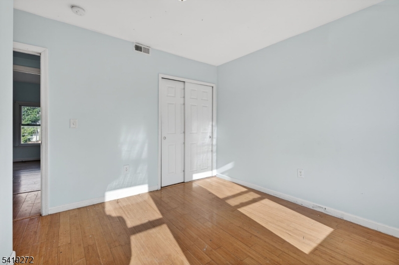 136 Smith Street Elizabeth, NJ 07201 - Photo 22 of 45 an empty room with wooden floor