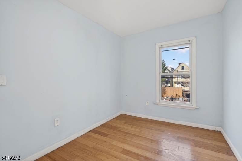 136 Smith Street Elizabeth, NJ 07201 - Photo 29 of 45 an empty room with a window