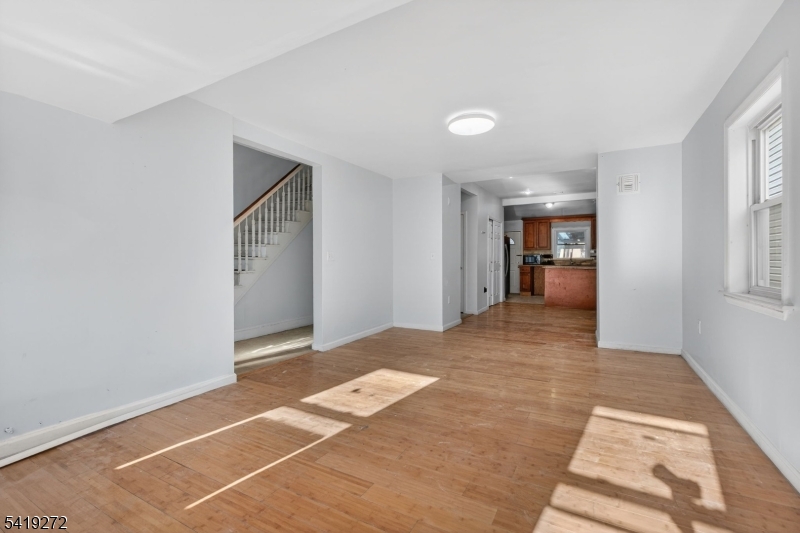 136 Smith Street Elizabeth, NJ 07201 - Photo 5 of 45 a view of an empty room and window