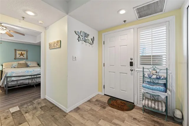a dining room with furniture window and wooden floor