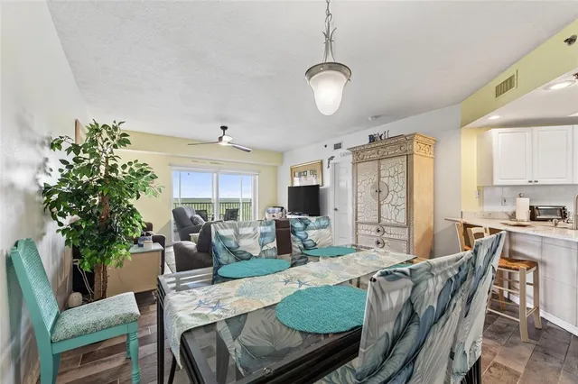 a kitchen with stainless steel appliances granite countertop a stove microwave and refrigerator