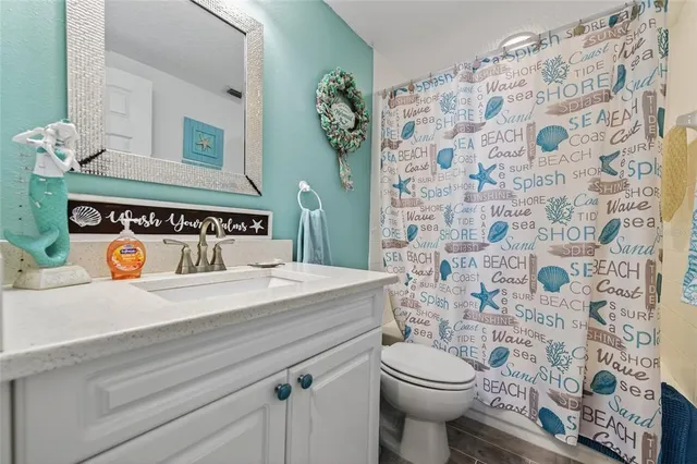 a view of a living room and floor to ceiling window