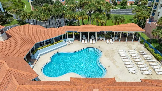 an aerial view of a residential apartment building with a yard