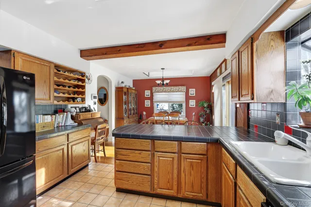 a view of a livingroom with furniture wooden floor and window