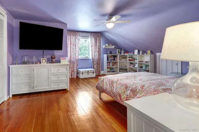 a view of a house with a yard covered in snow