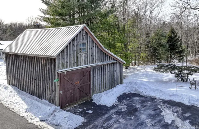 a dining room with furniture a chandelier and fireplace
