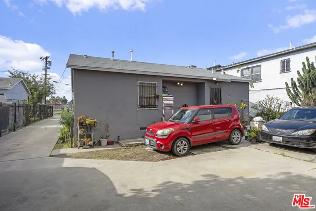 a front view of a house with parking space