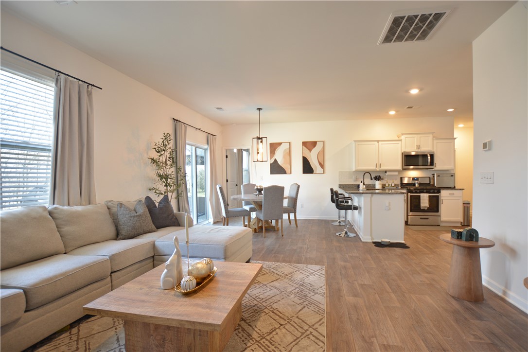 242 Hillendale Way Pelzer, SC 29669 - Photo 18 of 19 This open concept living space features comfortable entertaining and everyday living.
