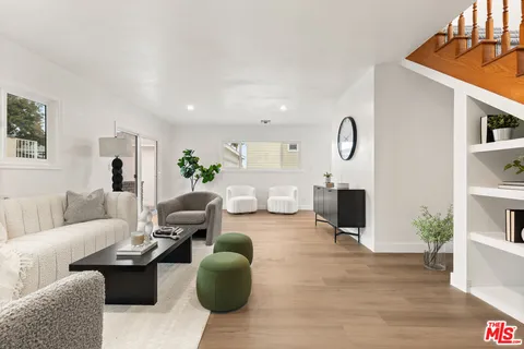 a living room with furniture a rug and a fireplace