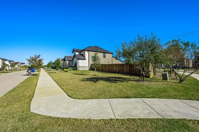 a view of a swimming pool with a yard