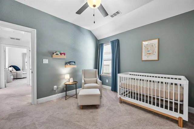 a bedroom with furniture and white walls
