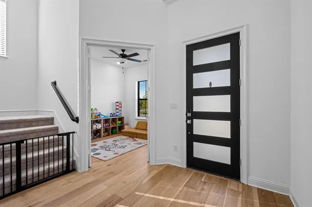 a view of front door with wooden floor